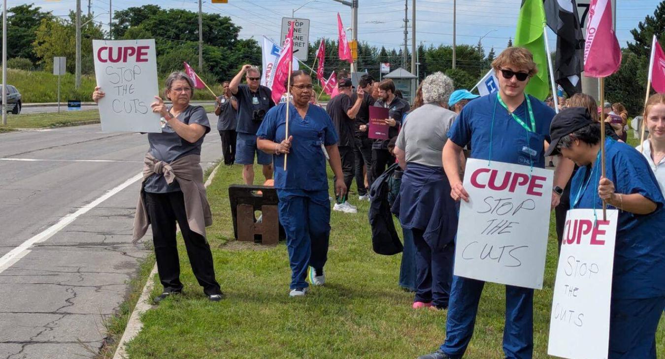 Members of the union gathered outside the Queensway-Carleton Hospital in Ottawa to protest cuts.